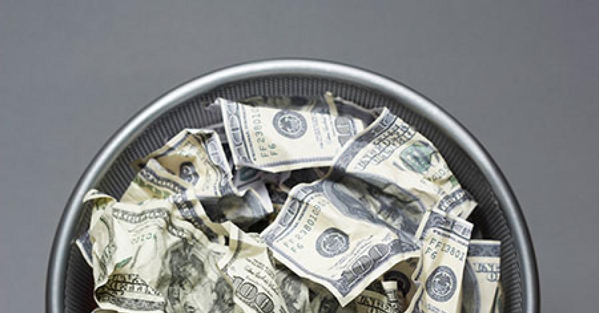 03b88228 money in wastebasket web