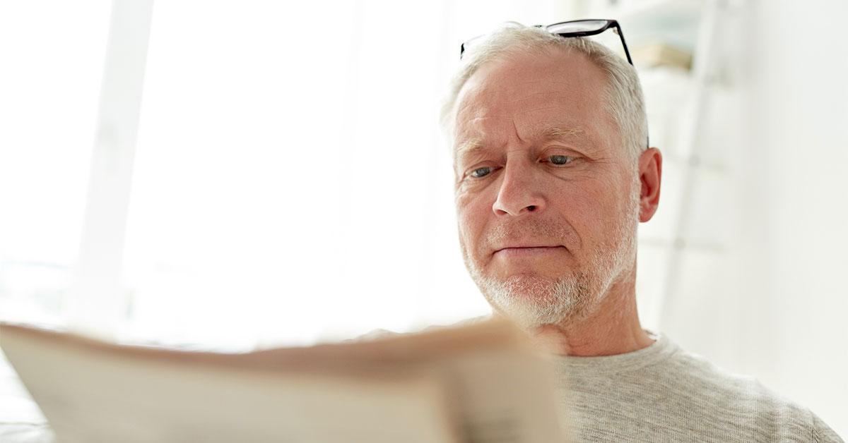 33594 208584 man reading newspaper web