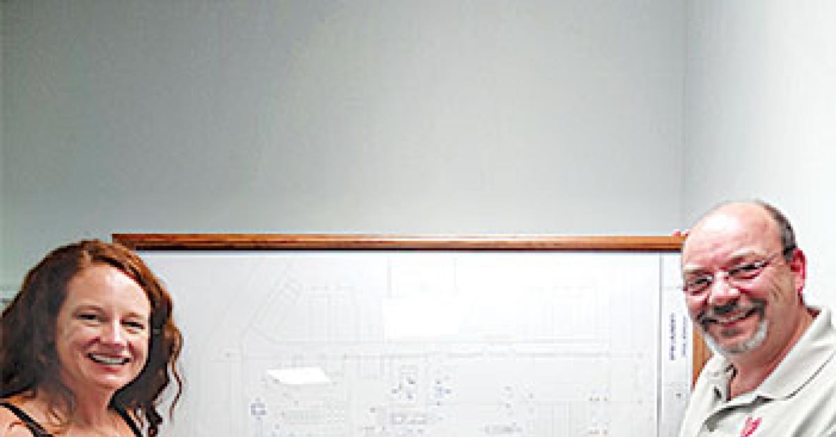 McGee and O'Neill with blueprint image