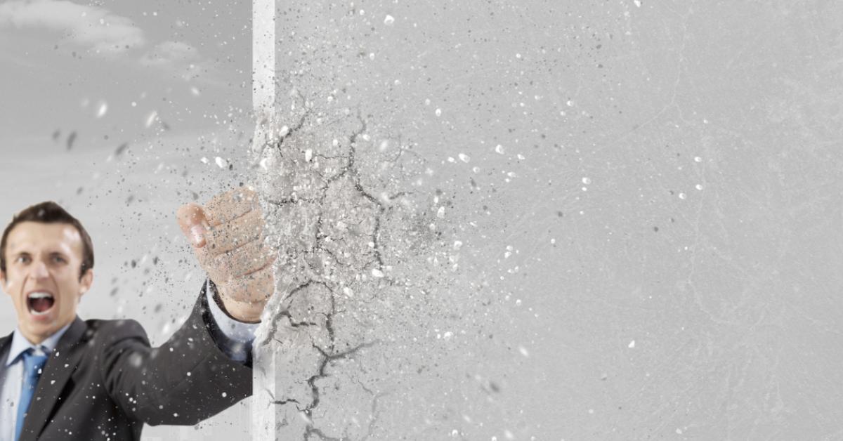 business man breaking glass