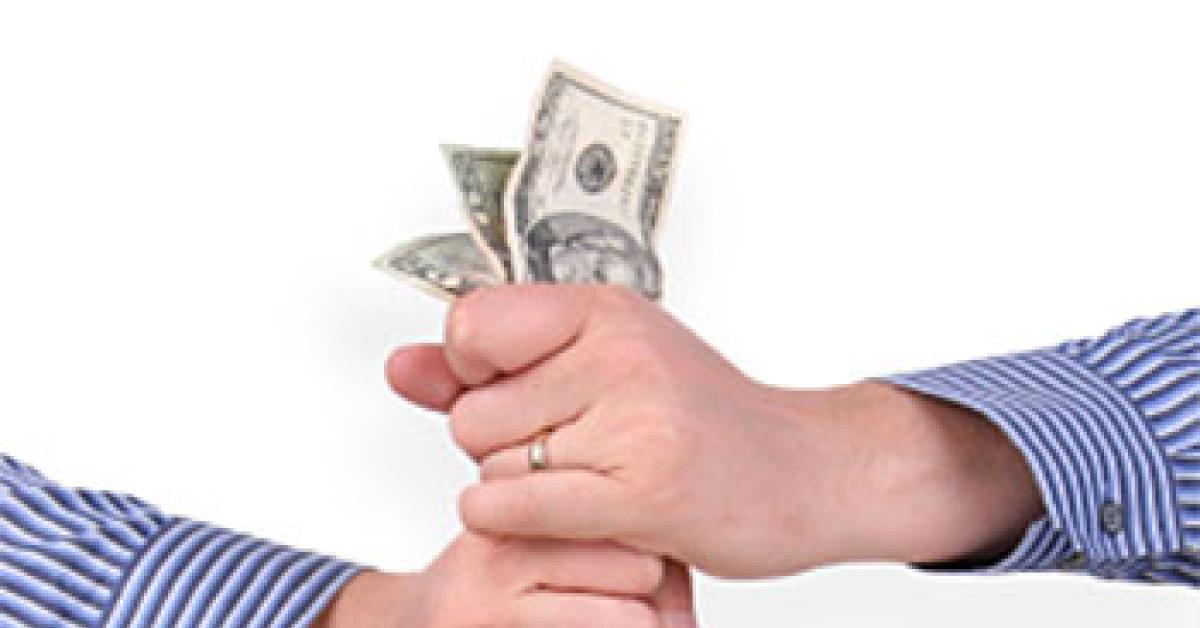 Hands wringing money