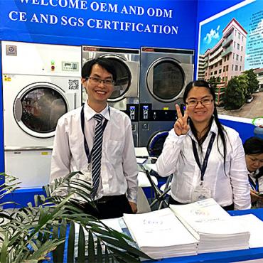  texcare asia 2017 two young people at booth smiling img 1812 web